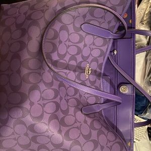 Large purple Coach bag . Also comes with purple purse organizer.